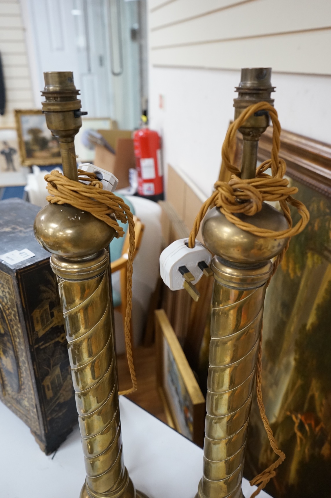 A pair of tall brass fluted column table lamps and arise and fall desk lamp, largest each overall 64cm high